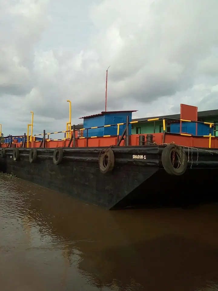 Flat-top barge operating on the river