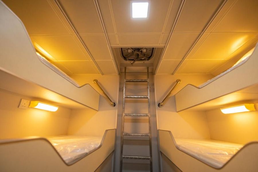 Crew boat bunk cabin with four bunks and a ladder